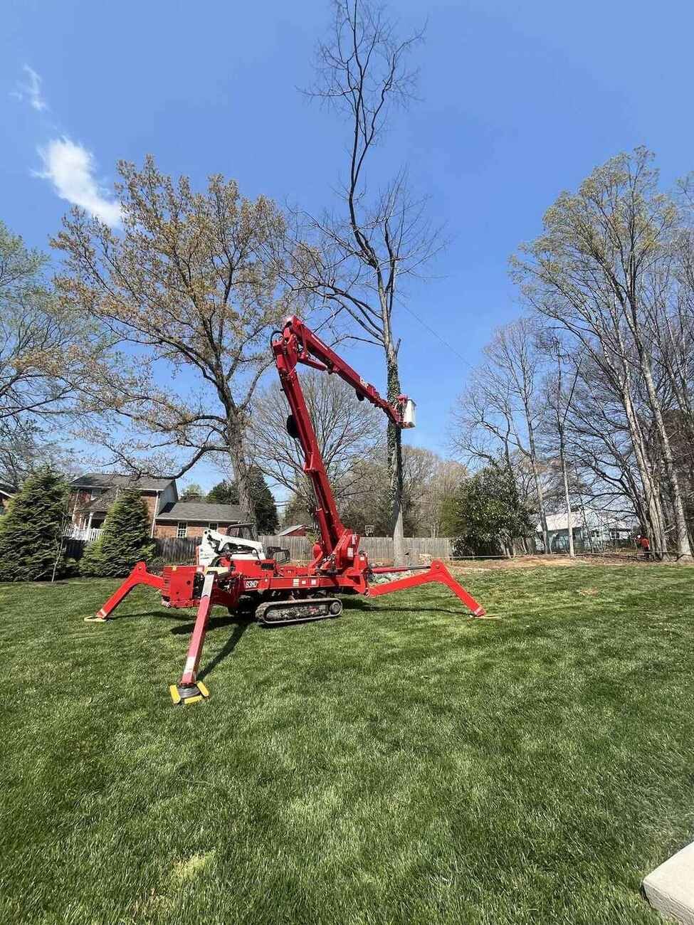 Spider lift staged on a Greensboro lawn — Green Limb Tree Service, Greensboro NC